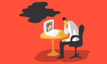 A graphic shows a man sulking at his desk while working from home.