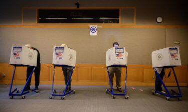 Voters stand in booths at a voting station at the Metropolitan Museum of Art (MET) during the mayoral election process in New York on June 12.