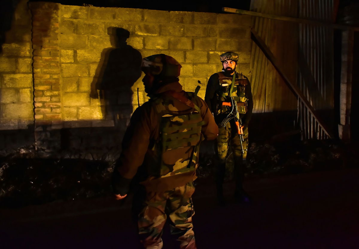 <i>Saqib Majeed/SOPA Images/LightRocket/Getty Images</i><br/>Paramilitary troopers stand guard at the site of an attack on the outskirts of Srinagar on December 13.