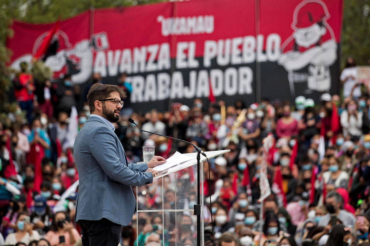 <i>Javier Torres/AFP/Getty Images</i><br/>Chilean presidential candidate Gabriel Boric speaks to supporters during a political rally in Santiago