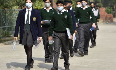 Students leave from an exam center after appearing for the Year 10 social science CBSE examination on November 30 in Noida