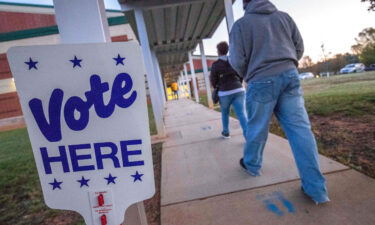 Voters arrive at a polling place in Charlotte