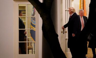 President Donald Trump and Chief of Staff Mark Meadows exit the Oval Office on January 4