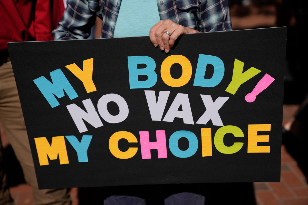 <i>Rebecca Blackwell/AP</i><br/>Trump-appointed judges question role of vaccines in fight against Covid as they block mandates. A person is seen holding an anti-mandate sign outside the Capitol on Nov. 16 in Tallahassee