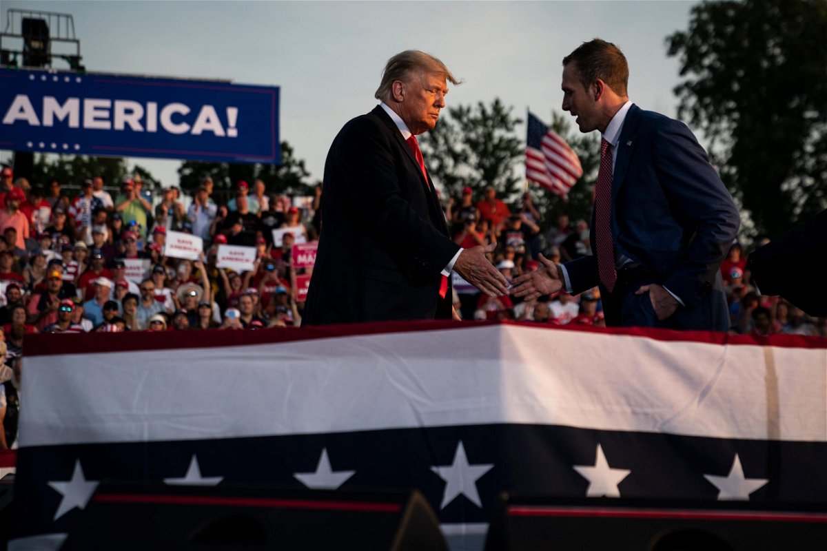 <i>Jabin Botsford/The Washington Post/Getty Images</i><br/>Former President Donald J. Trump speaks with Republican congressional candidate Max Miller at a rally at the Lorain County Fairgrounds in June in Wellington