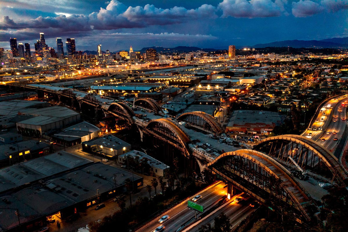 <i>Allen J. Schaben/Los Angeles Times/Getty Images</i><br/>An aerial view of a dramatic sky over the Los Angeles skyline as progress is underway on the Sixth Street Viaduct Replacement Project that crosses the 101 Freeway and Los Angeles River in Los Angeles on April 15.