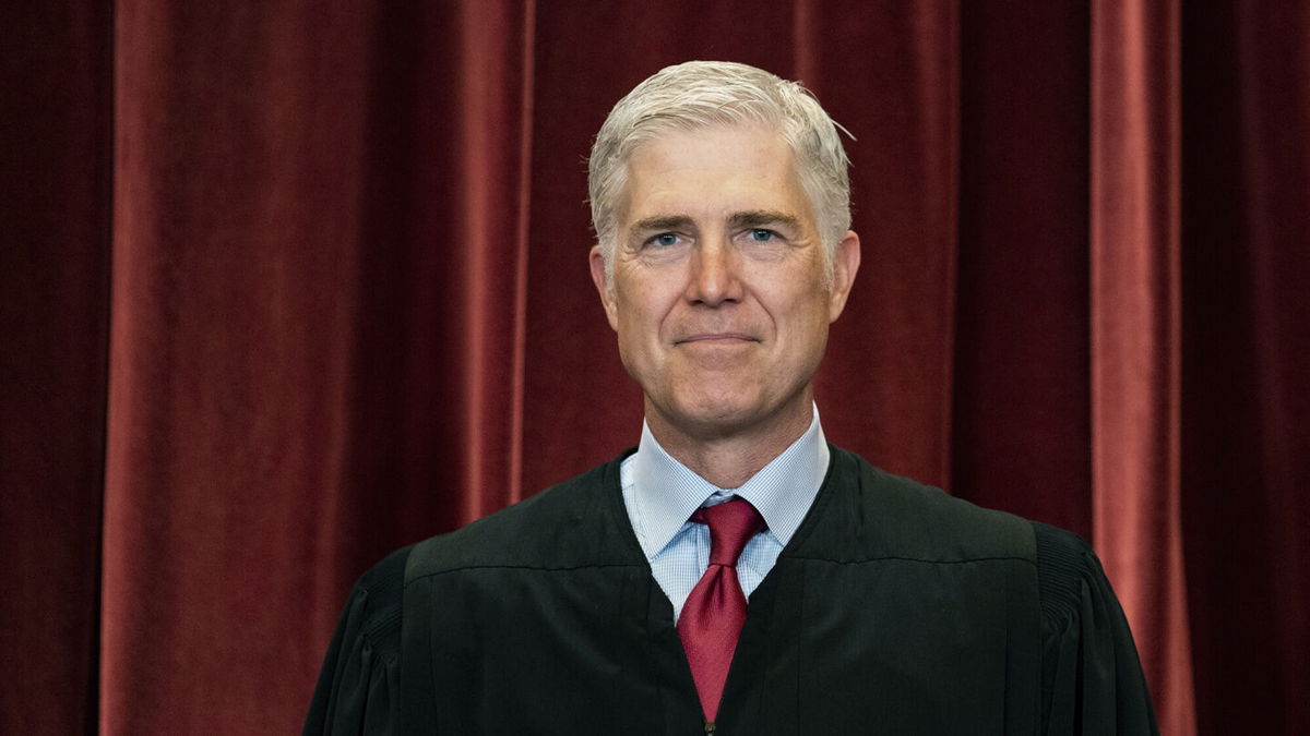 <i>Erin Schaff/The New York Times/Pool</i><br/>Associate Justice Neil Gorsuch stands during a group photo at the Supreme Court in Washington