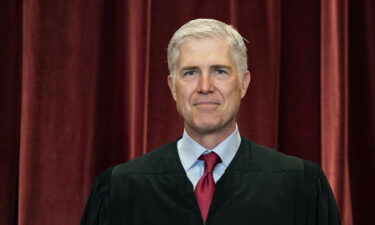 Associate Justice Neil Gorsuch stands during a group photo at the Supreme Court in Washington