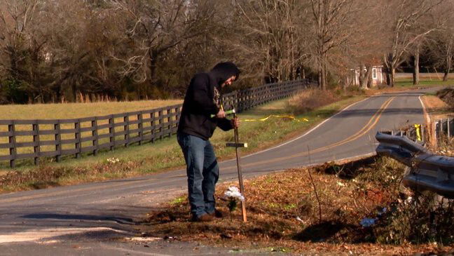 <i>WLOS</i><br/>James Lovelace put a small cross at the accident site on the corner of High Shoals Church Road and Goodes Grove Church Road in Rutherford County. He and other neighbors remember Trooper John Horton