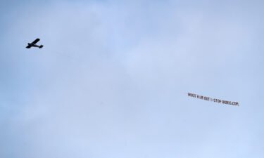 A plane flies over the stadium with a message directed to UK Prime Minister Boris Johnson during the Premier League match between Leeds United and Newcastle United at Elland Road.