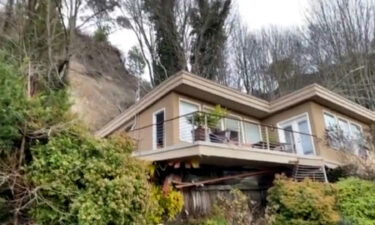 Seattle firefighters rescued a man trapped in the basement of his house during a landslide.