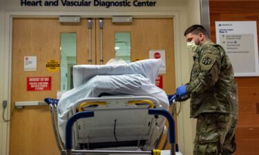 A soldier transports a patient at UMass Memorial Medical Center in Worcester