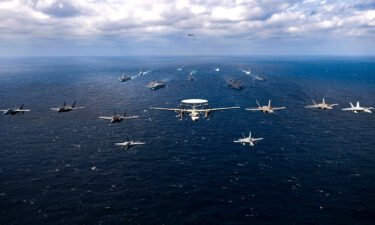 Aircraft fly over a US-Japan naval flotilla that included two US aircraft carriers in the Philippine Sea on January 22.