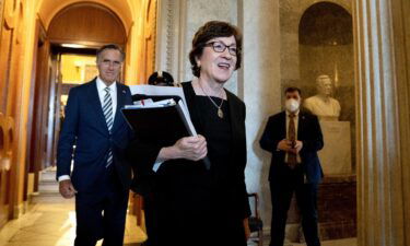 Republican Sens. Susan Collins of Maine and Mitt Romney of Utah depart the Senate Chamber on Friday