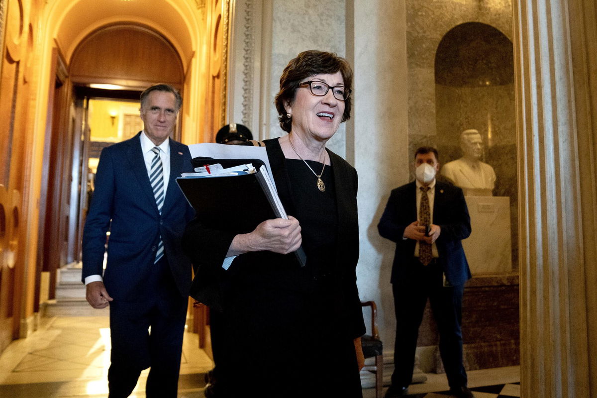 <i>Stefani Reynolds/Bloomberg/Getty Images</i><br/>Republican Sens. Susan Collins of Maine and Mitt Romney of Utah depart the Senate Chamber on Friday