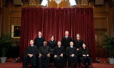 Members of the Supreme Court pose for a group photo at the Supreme Court in Washington