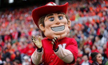 The University of Nebraska has changed its mascot's hand gesture associated with white supremacy. Nebraska Cornhuskers mascot Herbie Husker is seen here at a game in 2015.