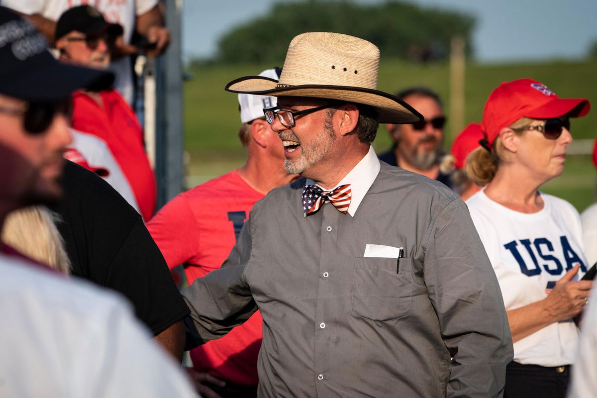 <i>Jabin Botsford/The Washington Post/Getty Images</i><br/>Douglas Frank talks with others before former President Donald Trump arrives to speak at a rally on June 26