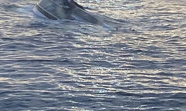 The US Coast Guard said a man was rescued from a capsized boat by a good Samaritan.