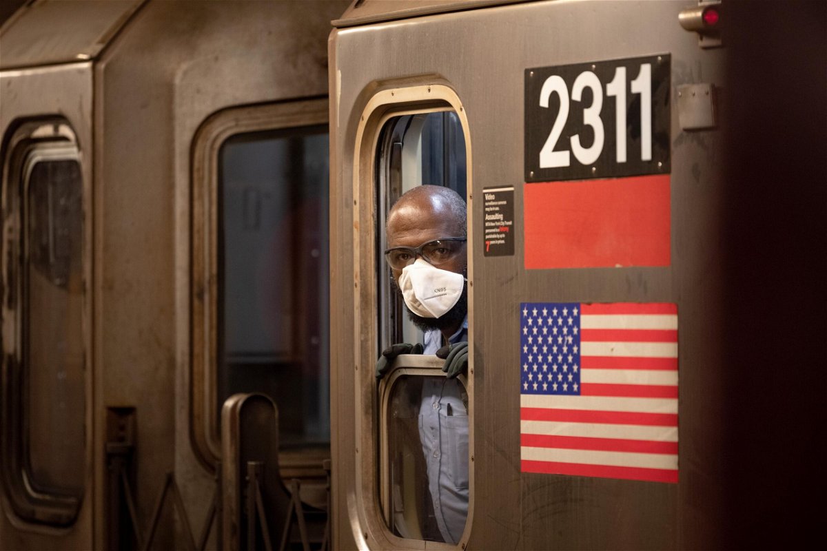 <i>Alexi Rosenfeld/Getty Images</i><br/>An MTA subway conductor wearing a KN95 face mask looks out of a window as the city continues Phase 4 of re-opening following restrictions imposed to slow the spread of coronavirus on August 9