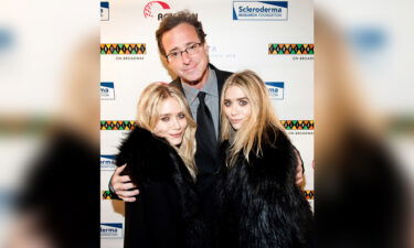 Mary-Kate and Ashley Olsen are paying tribute to their TV dad.