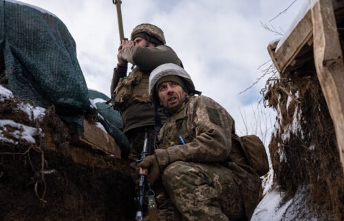 Ukrainian soldiers patrol on the frontline in Zolote