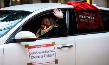 Members of the Chicago Teachers Union and supporters stage a car caravan protest outside City Hall