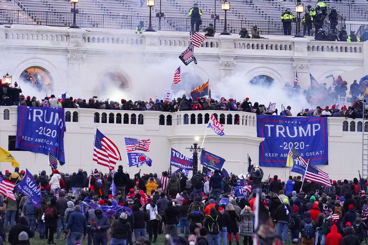 <i>John Minchillo/AP</i><br/>Rioters on the West Front at the U.S. Capitol on Jan. 6