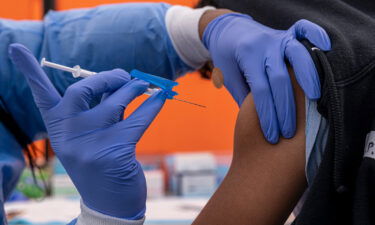 The US will require essential travelers crossing into the United States via land ports of entry and ferry terminals to be fully vaccinated for Covid-19 and provide proof of vaccination starting Saturday