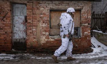 A Ukrainian soldier patrols outside of Verkhnotoretske