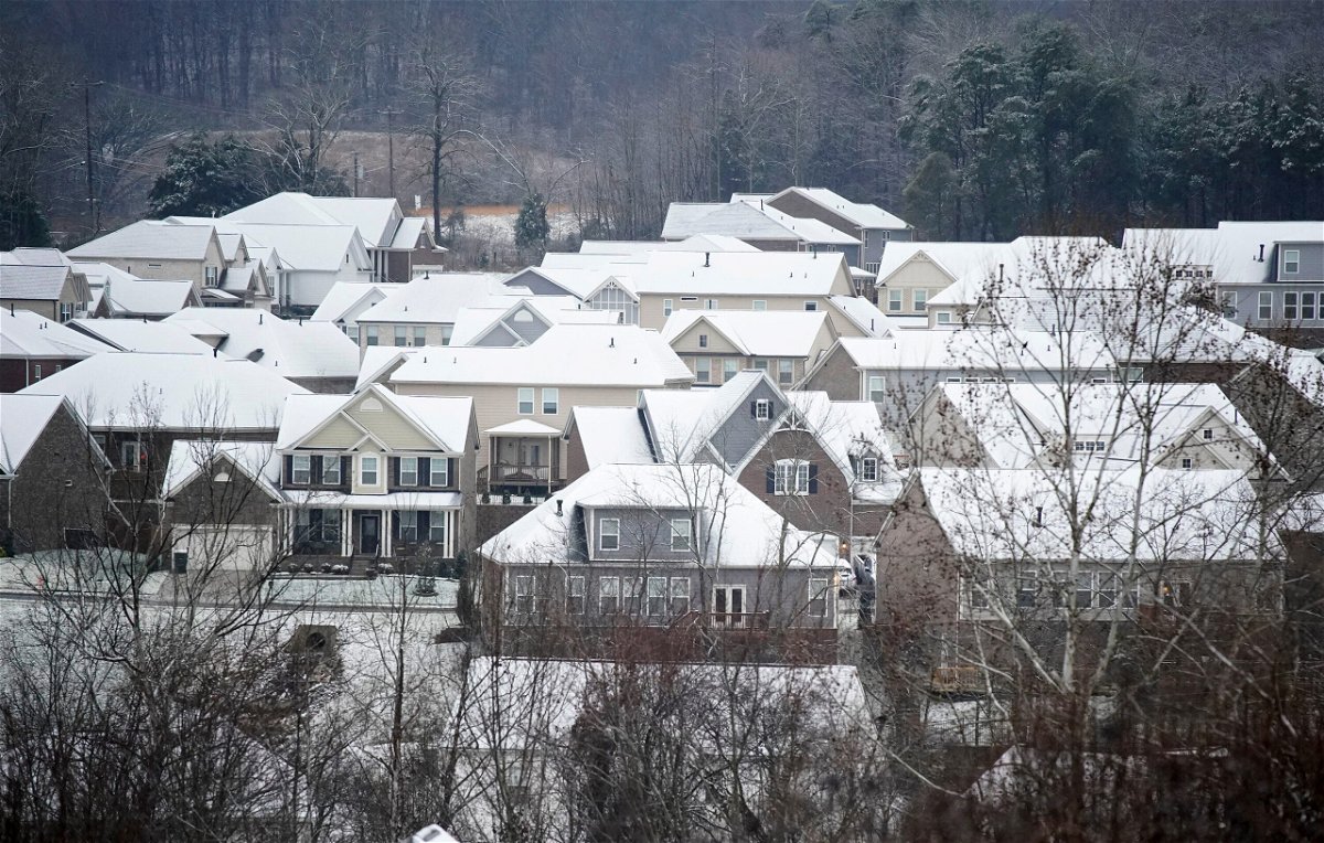 <i>George Walker IV/The Tennessean/USA Today Network</i><br/>Winter storms and spiking energy prices could lead to record high heating bills. Snow and rain fall on rooftops of houses Sunday