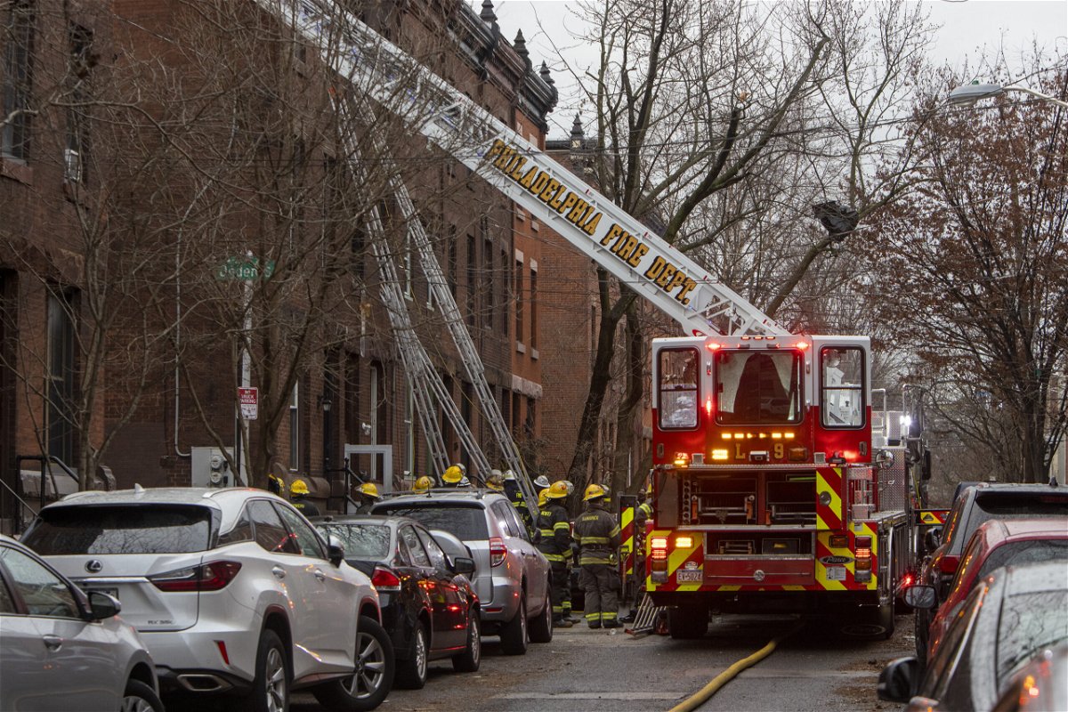 <i>Alejandro A. Alvarez/Philadelphia Inquirer/AP</i><br/>The Philadelphia fire department works at the scene of a deadly row house fire in Philadelphia on January 5.