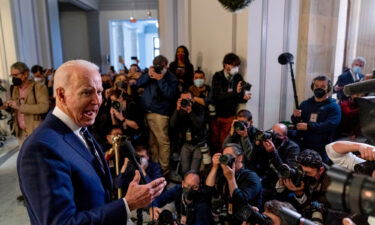 President Joe Biden speaks to members of the media as he leaves a meeting with the Senate Democratic Caucus to discuss voting rights and election integrity on Capitol Hill on January 13.