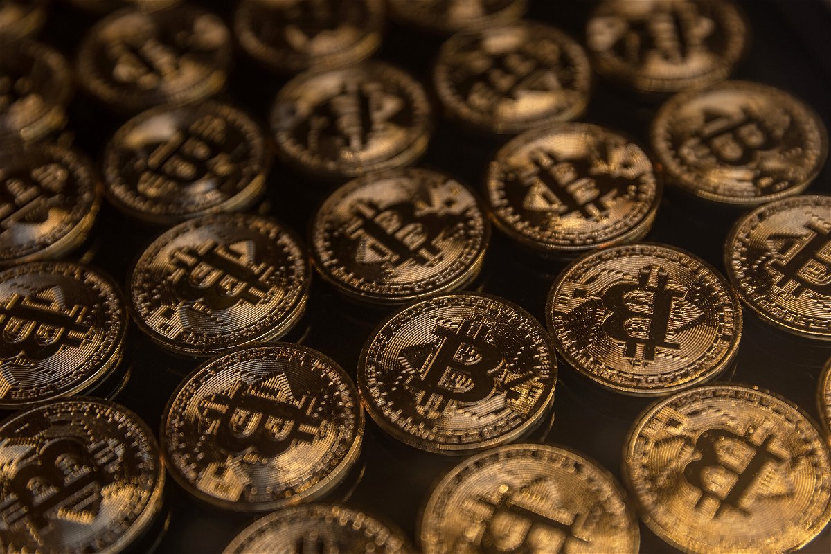 <i>Chris McGrath/Getty Images</i><br/>Gold Bitcoins are seen in the window of a Bitcoin and cryptocurrency exchange office on October 19