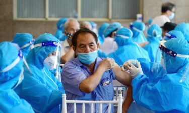 A man receives the AstraZeneca Covid-19 coronavirus vaccine in Hanoi on September 10