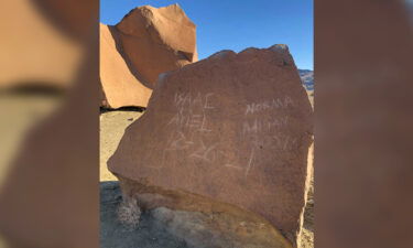 The ancient petroglyphs were defaced by visitors who scratched their names into the rock.