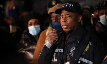 Mayor Eric Adams speaks to hundreds of police and fire officers at a vigil on January 22