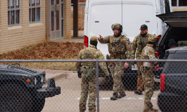 SWAT team members deploy near the Congregation Beth Israel Synagogue in Colleyville