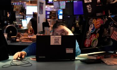 Traders work on the floor of the New York Stock Exchange at the opening bell on January 25.