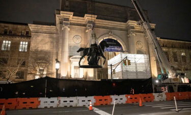 Workers remove part of a statue of Theodore Roosevelt that had stood outside the entrance to the American Museum of Natural History since 1940.