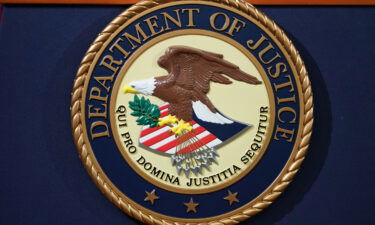 The Department of Justice seal is seen on a lectern at the Department of Justice in Washington