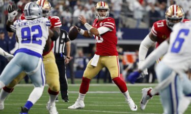 49ers QB Jimmy Garoppolo looking to pass against the Dallas Cowboys.