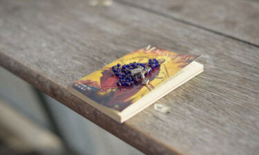 Vilma Kari lays out her rosary and Catholic prayer book.