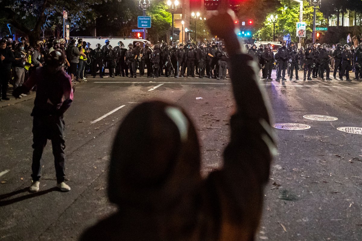 <i>Nathan Howard/Getty Images</i><br/>The Portland Police Bureau is conducting an internal investigation into a training presentation for dealing with mass protests that included a meme describing violence against protesters