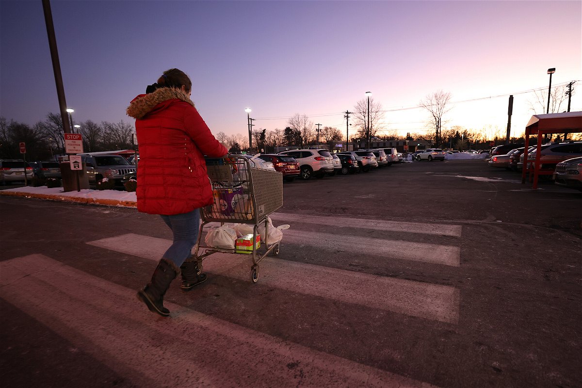 <i>Michael Loccisano/Getty Images North America/Getty Images</i><br/>A shopper leaves a ShopRite on January 8 in Clark