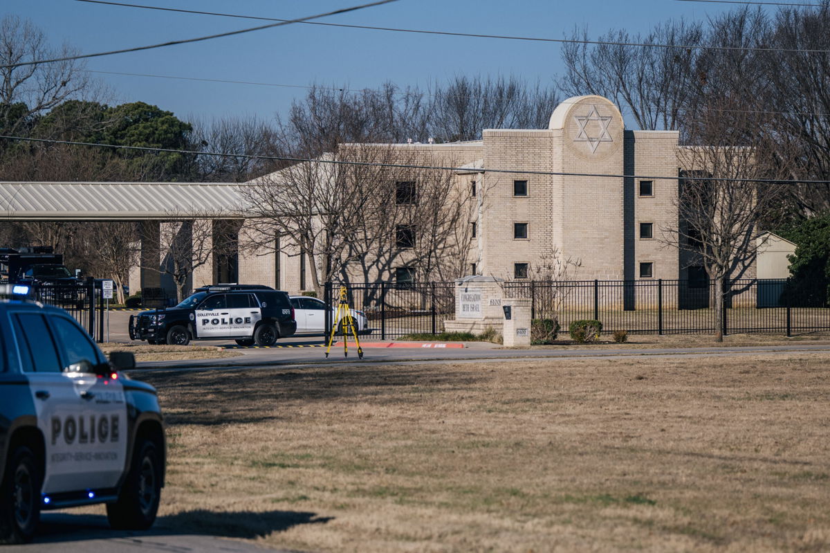 <i>Brandon Bell/Getty Images</i><br/>Police vehicles sit outside of Congregation Beth Israel Synagogue in Colleyville