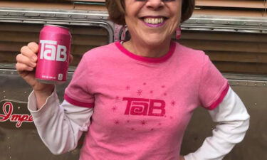 Jenny Boyter poses with a can of Tab.