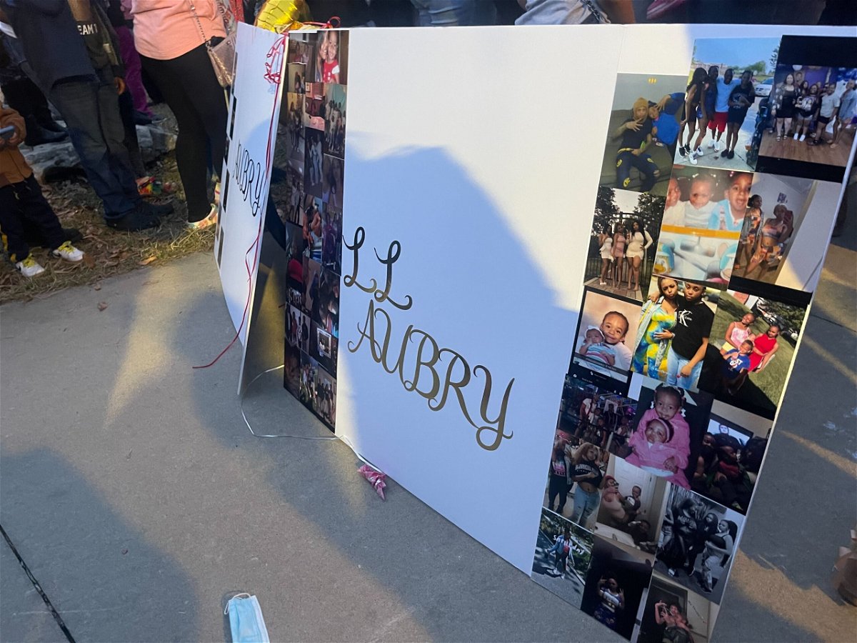 Photographs at a vigil memorialize Aubry Doxley, 15, who was killed in a shooting on McKee Street.