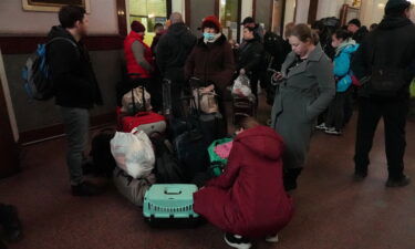 People search through belongings and plan where to go next.