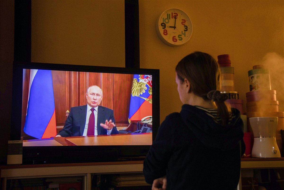<i>Andrey Rudakov/Bloomberg/Getty Images</i><br/>A resident watches a live broadcast of Russian President Vladimir Putin on Monday